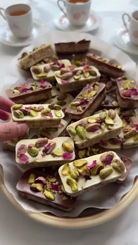 PISTACHIO WALNUT COOKIES #food #Recipe #foryou #fy #foryoupage #cookies #chocolate #walnut COATING 350 g chocolate (milk and white chocolate) COATING 100 g Maria biscuits 100 g walnuts 100 g unsalted pistachios 20 g honey 397 g condensed milk (1 can) GARNISH pistachios Grind the Maria biscuits in a food processor. Grind the pistachios in a food processor. Grind the walnuts in a food processor. Combine the ground Maria biscuits, walnuts, pistachios, honey, and condensed milk in a large bowl. Mix well. Melt the chocolate of your choice (milk or white) using a double boiler (au bain-marie). Pour a thin layer of melted chocolate into a silicone mold. Add a layer of the biscuit mixture and pour another layer of melted chocolate over it. Garnish with finely chopped pistachios and allow the chocolate to fully harden. TIPS Melt the chocolate slowly to avoid burning. Stir regularly and make sure no steam or water drops get into the chocolate, as it can affect the texture. When pouring the melted chocolate into the mold, gently tap the mold on your work surface. This helps remove air bubbles and ensures a smooth finish. Let the chocolate harden at room temperature before placing it in the refrigerator. This can help prevent the chocolate from becoming dull. You can use your favorite nuts. Preparation Time Prep time: approximately 20 minutes (including grinding ingredients and mixing the filling). Hardening time: at least 2 to 4 hours for the chocolate to set properly (1-2 hours in the fridge).