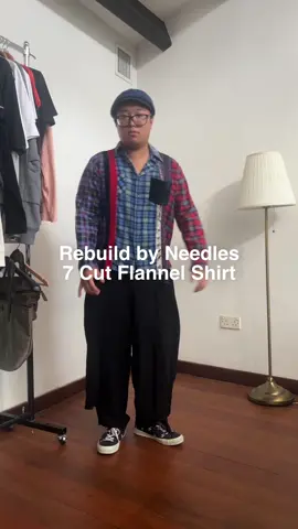 Rebuild by Needles 7 Cut Flannel Shirt Brainchild of Keizo Shimizu, Rebuild by Needles was founded in 2012. Focusing on breathing new life into old garments through deconstruction and reconstruction. Stitching together different parts, the line creates one-of-a-kind reinterpretation on everyday wardrobe staples, extending their lifespan through sustainable and innovative design. Its predescessor — Sonic Lab was founded in 2002 with the same design ideologies. Sonic Lab was focused on creating military, workwear inspired garments in an American Casual style for the everyday person. This laid the groundwork for the designs present in the Rebuild by Needles lineup. A staple of the ongoing Rebuild program is none other than the 7 Cut Flannel Shirt. Celebrated for its concoction of classic Americana, DIY aesthetics, and Japanese craftsmanship. The shirts often have an unfinished, raw look with a mix of textiles, prints, and colors. By deconstructing and fusing seven panels from vintage shirts, Keizo Shimizu revived the appeal of a classic silhouette. Celebrities like A$AP Rocky and Travis Scott have been spotted wearing Needles' flannels, contributing to its rapid rise in mainstream fashion​. This checkered flannel is accented with panels of solid colors, and shiny materials. #needles #nepenthes #rebuildbyneedles #archive #Runway #fashionhistory #commedesgarcons #kapital #travisscott #asaprocky