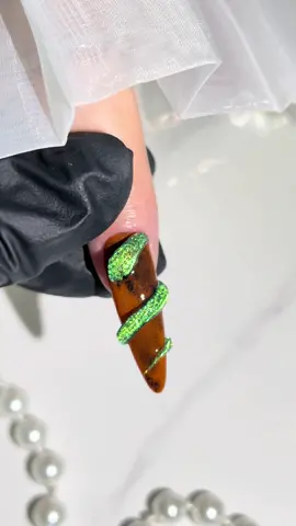 Bold Earth-Tone Nails with 3D Snake and Green Cat-Eye Accent #nailart #nailarttutorial #nailsupply #nailtrends #nailsalon #fyp #infilila #3dnailart #nailinspo #animenails #snakenails #nailsartvideos 