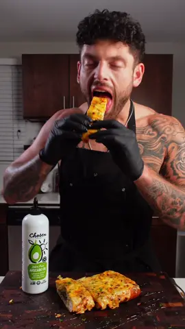 Garlic Bread w/ @Chosen Foods   Get a squeeze bottle of avocado oil, see for yourself! Ingredients:     - 1x Bread loaf     - 1x Shallot     - 1x Garlic bulb     - @Chosenfoods 100% pure   Avocado Oil     - Red pepper flakes/salt/pepper     - Butter     - Minced serrano pepper     - Parsley     - Cheddar/mozzarella cheese     - Hot honey glaze   #ChosenPartner