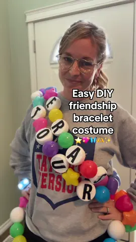 I ✨am✨ the friendship bracelet ☺️ All you need is: 🟣 Ball pit balls ⚪️ Styrofoam balls 🔤 Letter stickers 🧵 Wire or string 🪡 Looong needle This cost around $35 to make and only took an hour or so! How’d I do?! Inspired by @Reagan Baylee 🫶 #taylorswift #TSTheErasTour #erastouroutfit #erastouroutfit #taylorswiftcostume #diycostume #erastour #theerastour 