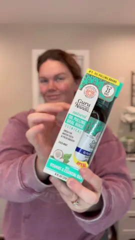I’ve been hearing so much about oil pulling, so I decided to give it a try with @GuruNanda LLC Cocomint Pulling Oil. #sponsored This blend of fractionated coconut oil, seven pure essential oils (like peppermint, spearmint, and clove), plus Vitamins D3, E, and K2 is a natural way to freshen breath, support healthy gums, and even whiten teeth! 🦷✨ It’s alcohol-free, fluoride-free, and cruelty-free, making it perfect for daily use. Just swish for 2-10 minutes, spit and brush for a holistic take on oral care. I’ve been loving how fresh it leaves my mouth feeling and it’s packed with natural antiseptic and antibacterial benefits to boost gum health too. So what do you think, would you give oil pulling a try? 🦷 #oilpulling #oralhealth #DailyRoutine #grwmroutine #MomsofTikTok   