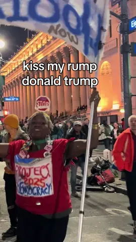 Protestor sings “KISS MY RUMP DONALD TRUMP” while dancing outside the MAGA rally at Madison Square Garden. 