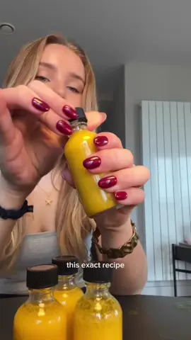 the recipe that changed OUR skin⭐️ ingredients: 🧡 2 inches fresh turmeric root (or 2 tbsp turmeric powder) 🧡 4 inches fresh ginger root 🧡 1 lemons 🧡 1 orange (optional - makes it taste much nicer) 🧡 2 cups water - I always go to the fill line on my blender 🧡 a pinch of black pepper (to enhance absorption of turmeric) 🧡 2 capfuls olive oil (these shots are best absorbed with added fat) Instructions: 🧡 Peel & chop the lemon (& optional orange). 🧡 In a blender, add turmeric (fresh or powdered), ginger, lemon, (optional orange) & water. 🧡 Blend until smooth. 🧡 Strain mixture through a sieve/cheesecloth to remove pulp - you can freeze the pulp if you wish. 🧡 Add olive oil & black pepper. 🧡 Pour into shot glasses / small containers. 🧡 They last 3-4 days in the fridge, or freeze for longer. please leave any questions you have below my lovelies!! And there are acne healing guides in my b¡0 for those of you who need some extra support with your skin💗 •  #gingershot #acne #healacnenaturally #skintok #skincare #skincaretips #clearskin #antiinflammatory