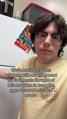 hanging eggs from the top of the fridge.