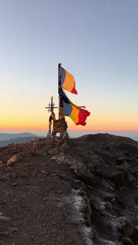 How many words, really, can do justice to the first light cresting over Moldoveanu Peak? In the heart of the Făgăraș Mountains, Romania’s tallest sentinel rises, a place of rarefied silence and primal beauty. As dawn unfurls, it bathes the jagged, ancient spine of these mountains in colors so intense they seem drawn from a palette reserved for gods. Up here, at 2,544 meters, you’re enveloped in an ethereal quiet, a silence disturbed only by the whisper of the wind through stones older than memory. The vastness of this panorama makes even the smallest human feel reverent, tethered to the land in unexpected ways. The Făgăraș range itself is a geological cathedral, sculpted by time and tectonics into dizzying cliffs and deep, hidden vales. Moldoveanu, its apex, offers a 360-degree vista—cloudbanks rolling like ancient seas, ridgelines unfurling like ink-strokes across the horizon. The colors of dawn here defy easy description: molten Oranges, Silken Purples, and the softest Indigo hues, each bleeding seamlessly into the next. It’s a place that captures the imagination of mountaineers, poets, and those who crave the quiet grandeur of nature unbound. Moldoveanu stands not just as a peak, but as a pilgrimage point for all drawn to Romania’s wild majesty. What might one feel, standing there, as the world below slowly comes to life? There’s a certain humility that the mountain instills, a quiet awe in the presence of its immensity. From this vantage, all is sublime, unadulterated, and far beyond the reach of civilization's hurried pace. Is it any wonder, then, that so many who climb Moldoveanu are left enchanted, forever craving that rare dawn from the roof of Romania? Video by @Lebuş  [Romania, Fagaras Mountains, Moldoveanu Peak, Carpathians, Sunrise Colors, Mountain Vistas, Panoramic Views, Alpine Beauty, High Peaks, Romanian Landscapes, Wilderness Trekking, Mountaineering, Romanian Nature, Dawn Over Mountains, Geological Formations, Nature Photography, Rugged Landscapes, Spiritual Places, Scenic Romania, Solitude] #Romania #Travel #MountainViews #SunrisePhotography #HikingAdventures #RomanianNature #FagarasMountains #OutdoorExploration #MountainPeaks
