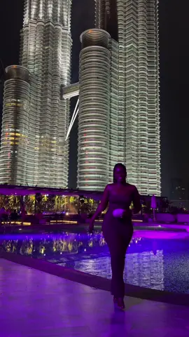 An oh polly dress hates to see Norah coming 😅 #Malaysia #kualalumpur #ohpolly #wetdeck #fashiontiktok #fyp #blacktravelfeed #traveltiktok #petronastwintower 