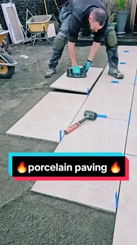 the daily grind 💪 1000x500 porcelain slabs going down a treat 👌#fyp #foryou #howto #landscaping #construction #paving #porcelain #gardenproject #dewalt 