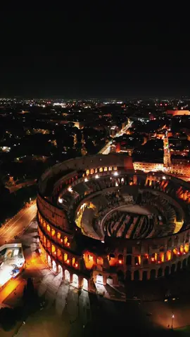 The Colosseum in Rome at night from a drone’s perspective 🌙 Have you ever seen this iconic landmark illuminated in such a magical way? #CatchTheMoments #Colosseum #RomeByNight #DronePhotography #ViralMoments #ForYouPage #FYP #ExploreRome #HistoricalLandmarks #BeautifulDestinations #TravelGoals #Wanderlust #ItalianNights #EpicViews #TravelInspo #NightPhotography #CityLights #ArchitecturalWonders #AdventureAwaits