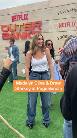 #madelyncline finds costar #drewstarkey on the carpet at the season 4 #outerbanks poguelandia experience 
