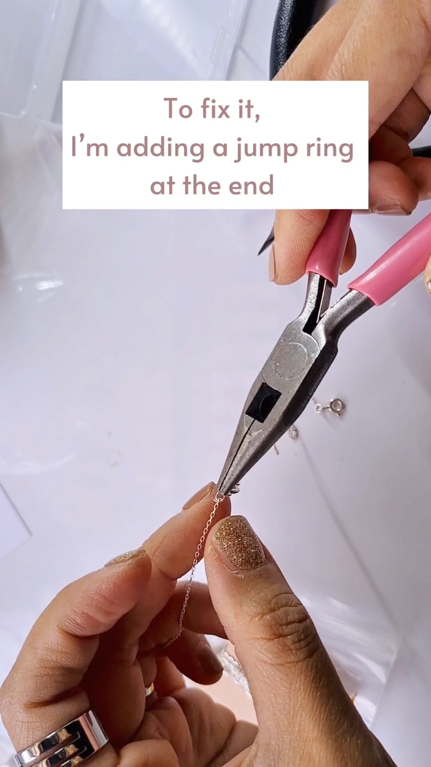 How to Repair a Broken Bracelet with a New Chain Extension Jewelry craft DIY at home Tutorial  Captions: 1. 😱 Oh no! My bracelet got pulled, and a part went missing. 2. To fix it, I’m adding a jump ring at the end and attaching a new chain. 3. First, measure the length I need and cut the chain to size. 4. Next, attach a small jump ring to secure the chain. 5. Since the chain is thin, I’m adding a larger ring for an easier clasp. 6. 😍 That's it! My bracelet is as good as new! #diyjewellerymakingathome #howtomakeaccessories #braceletdiy #howtorepairjewellery #diyhandmadejewelry #jewelrytutorials 