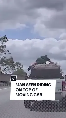A man has been captured in the midst of a risky act, riding on top of a moving car on a busy Queensland motorway on Sunday morning. Dashcam vision shows the person lying down on the roof of the Ford Ranger as it travels across lanes at around 100km/h. The man then attempts to climb back into the vehicle through the passenger window. #10newsfirst #queensland #logan #dashcam 