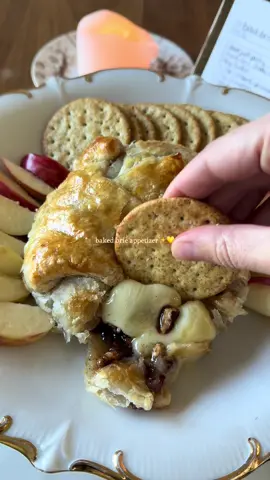 Baked Brie Appetizer ✨💛 Ingredients: 1 sheet puff pastry 1 round Brie cheese (8oz) 2 tbsp butter 1/2 cup chopped pecans 1/2 tsp cinnamon 1/4 cup brown sugar 1 tbsp maple syrup 1 egg, beaten Instructions: Preheat oven to 400 degrees. Grease a small oven safe dish, place puff pastry in the dish, and set aside. In a small saucepan, melt butter over medium heat. Add the pecans and cinnamon and heat until browned, stirring occasionally, about 2-3 minutes. Pour pecan mixture into a small bowl. Add the brown sugar and stir until combined. Place brie in the middle of the puff pastry. Pour maple syrup over top, then the pecan mixture. Fold the edges of the pastry over top, then brush with an egg wash. Bake for 20-30 minutes, or until golden brown. Place brie on a serving platter and serve with crackers or apple slices.  Enjoy! #appetizer #appetizers #christmasappetizer #thanksgivingappetizers #thanksgivingrecipes #christmasrecipe #bakedbrie #puffpastry #foryou #foryoupage #fyp 
