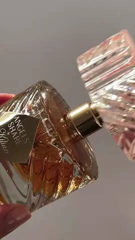 @KILIAN PARIS Angels Share ✨ Imagine wrapping yourself in the warmth of Kilian Angels' Share, a fragrance that feels like slipping into a quiet, candlelit evening by the fire. The first note is a deep, inviting cognac—rich and bold, as if you've just uncorked something rare. Cinnamon and oak swirl around, grounding you in a soft, spicy warmth, while hints of praline and tonka bean add an irresistible sweetness that feels almost like a stolen moment. As it settles, sandalwood and vanilla linger on your skin like a whispered secret, making you feel decadent, bold, and entirely unforgettable.  #perfumetok #kilianangelsshare #trendingfragrances #kilian #fragrancereccomendations #perfumeunboxing 