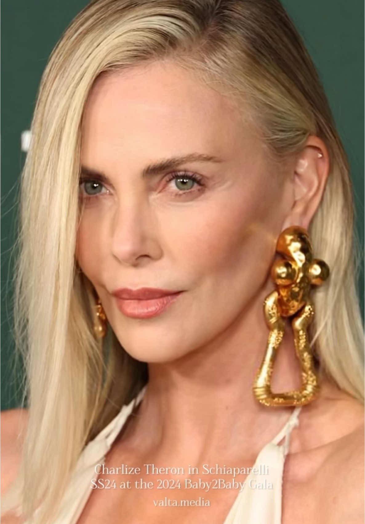 Charlize Theron graced the 2024 Baby2Baby Gala in Los Angeles, where she received the esteemed Giving Tree Award, an honor given to public figures “who have shown exceptional dedication to improving the lives of children in need.” Theron’s dedication shines through her Charlize Theron Africa Outreach Project, which is devoted to expanding healthcare and educational opportunities for young people across Africa. For the gala, she wore a captivating Schiaparelli gown from the spring 2025 collection, featuring a dark wash denim corset and a plunging neckline. Paired with bold gold statement earrings and metallic heels, her look blended elegance and modernity. #Fashion #Style #CrlebrityFashion  #CharlizeTheron #Baby2BabyGala #Schiaparelli #RedCarpetFashion #FashionInspo #StyleInspo