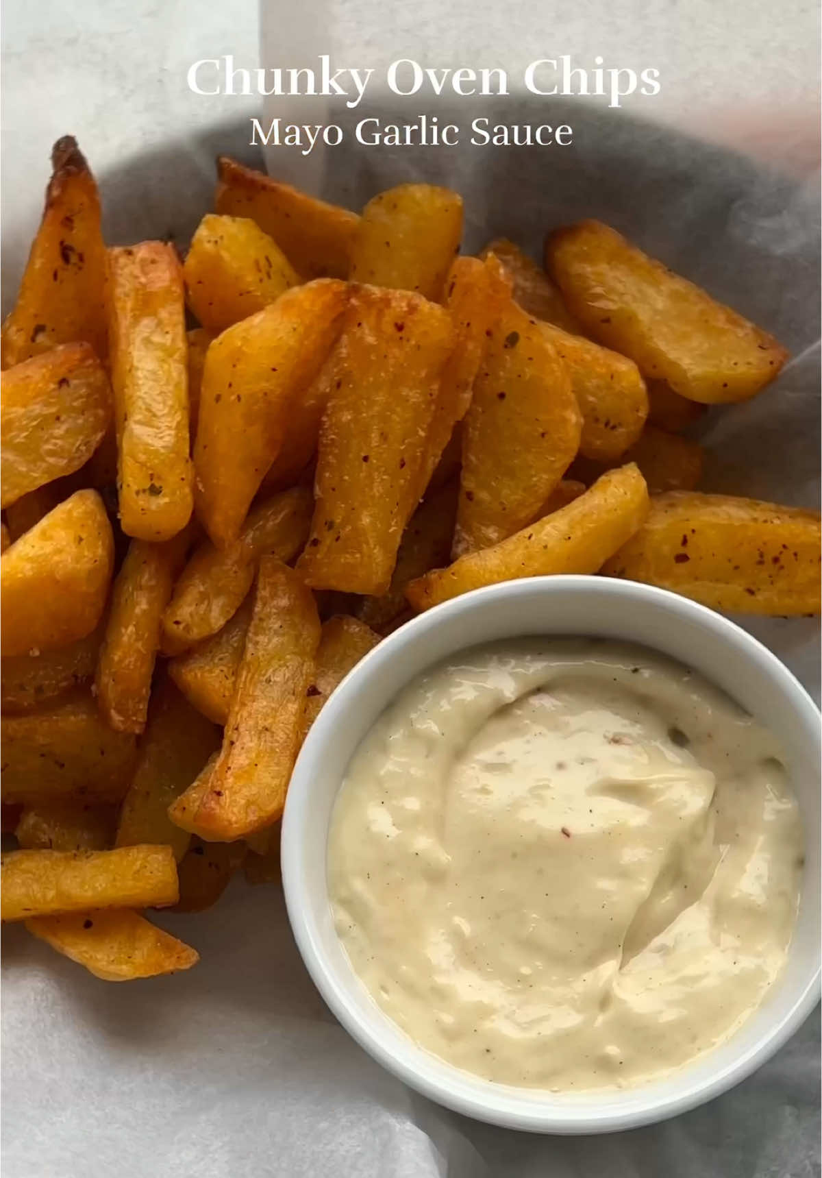 Chunky baked chips with Mayo garlic sauce Oldie but a goodie 💫   4 large potatoes (Russet) 1 tsp Sea salt 1 tsp Gochugaru or crushed chili 1 tsp Oregano 3-4 tbsp garlic confit oil Sauce: 1 cup garlic cloves, peeled Extra virgin olive oil 1 cup mayo Salt and pepper to taste Preheat the oven to 200°C (390°F). Cut the potatoes into chunks, wash them, and parboil in salted water for 8 minutes. After draining, let them dry for 10 minutes. Combine sea salt, Gochugaru, oregano, and garlic confit oil. Pour this mixture over the potatoes, then bake for 1 to 1.5 hours. Remember to flip the potatoes every 20-30 minutes during baking. -Sauce Roast peeled garlic cloves in olive oil at 180°C (350°F) for 1 hour until soft. Mash some roasted garlic into mayo, add salt and pepper to taste. . . . . . . . . . . . . . #potatochips #nakedchunkychips #chunkychips #bakedpotatoes #bakedpotato #crispypotatoes #mayogarlic #garlicconfit #asmr #asmrfood #potatorecipes