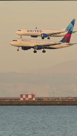 Parallel landing capture from SFO featuring a Delta A320 racing a United 737. by that1spotter #aviationdaily #aviationlovers #avgeek #aviationtiktok #friday #landing 