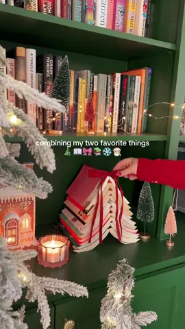 Let’s make a book christmas tree 🎄❤️📖 I can’t believe how cute this turned out! It’s super simple to make 🫶🏻 Place a base at the bottom ( i used a round faux candle) to prop up the books, and then just stack 8-10 books to make the tree. So sdorable and looks so festive on my bookshelf! #cozyvibes #cozyhome #bookish #booklover #christmas vibes #christmasdecor #christmasaesthetic #christmasmood #xmasdecor