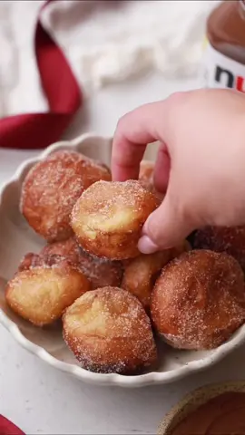 (ad) Warm Fritters dipped in Nutella 🍩 These crispy, golden fritters dipped in Nutella are made for movie nights with family. Warm and perfectly sweet, they’re an irresistible snack everyone will reach for! These little treats for bringing everyone together in front of a cozy holiday movie. Get the recipe at the link in our bio! #feedfeed #fritters #donuts #doughnut #holidaybaking #bakingdesserts #desserts #nutella #holidays #baking 🎥 @Hannah Dela Cruz 