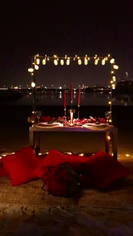 Romantic date night decor by the beach with a view of burj khalifa  #dubai #birthdaysurprise #uae #surprisedecor #romanticdinner #candlelightdinner #burjkhalifaview #beachsetup #beachpicnic #luxurypicnic #dubaidecorator #birthdaydecor #birthdaysetup #hotelroom #birthdayroomdecor #عيدميلاد #hotelroomdecor #beachday #palmjumeirah 