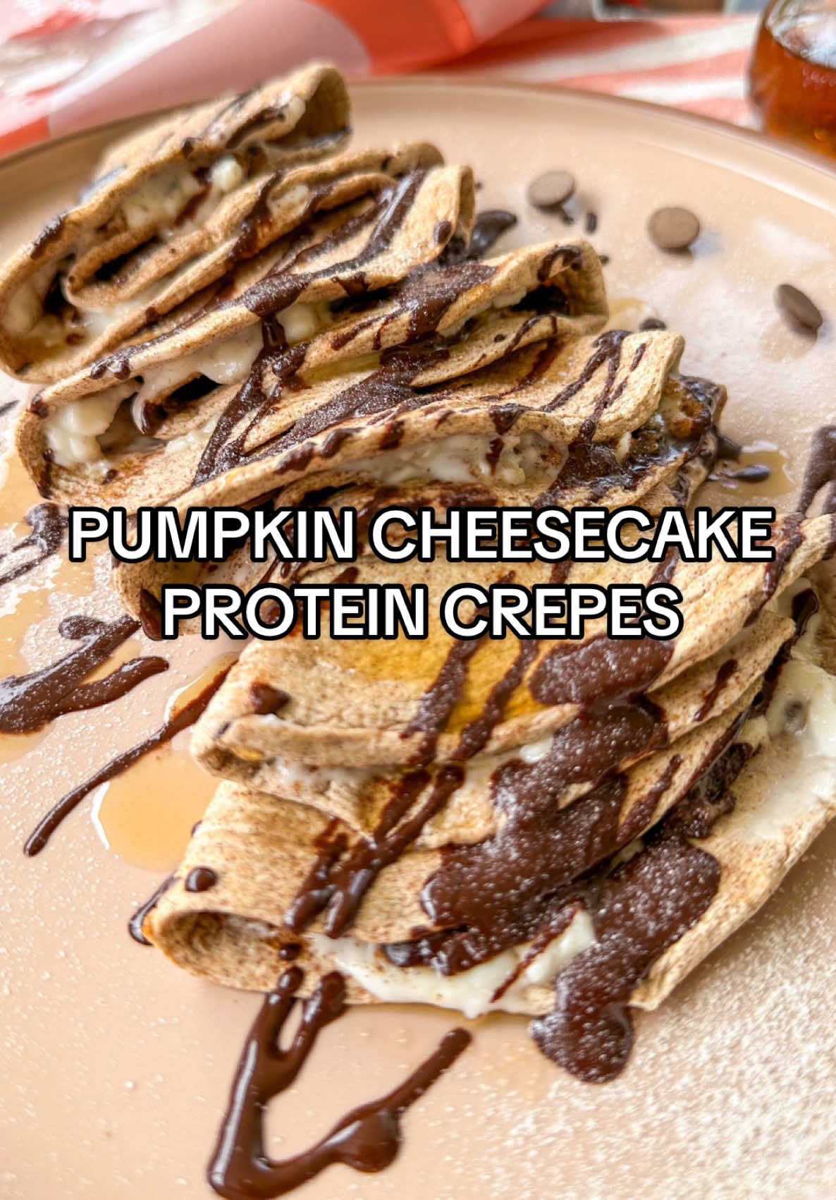 PUMPKIN CHEESECAKE PROTEIN CREPES! Starting my morning with a high protein breakfast keeps my cravings in check. And this plate has over 20g, thanks to @egglife egg white wraps ! Each sweet cinnamon wrap is just 30 calories, 5g protein, and 0g sugar—a perfect, blood-sugar-friendly treat for fall in my opinion. Every household needs to have these wraps on hand! Stay on track with your health goals this holiday season, go grab sweet cinnamon egglife wraps in the refrigerated section at Kroger, Whole Foods, Target and more! #egglifepartner #highproteinrecipes #highproteinbreakfast #highproteinsnack #highprotein  To make 👉🏼 spread softened dairy free cream cheese on a wrap, sprinkle pumpkin pie spice and chocolate chips, then heat in a lightly oiled pan for 30 seconds. Fold, and top with a drizzle of maple syrup, melted chocolate and powdered sugar for an indulgent breakfast or dessert!