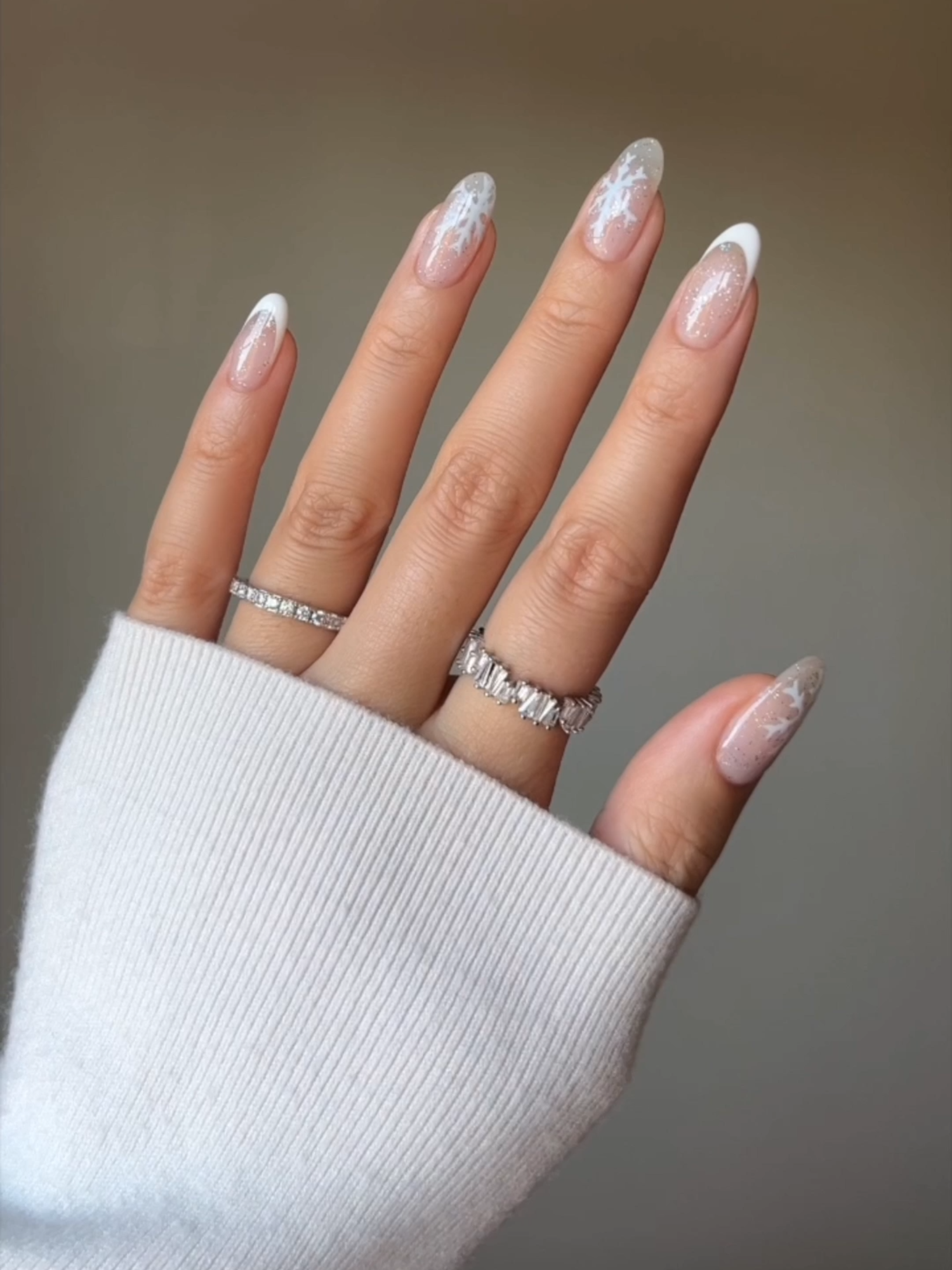 It's cold girl season.❄️🎀☃️ Try these minimal snowflake nails by @nailsbyalsn. To achieve this look, all you need is a fine nail art brush liner and your favourite glitter topper.✨ Produced in association with CBC Creator Network. #winternails #snowflakenails #holidaynails #nailinspo2024