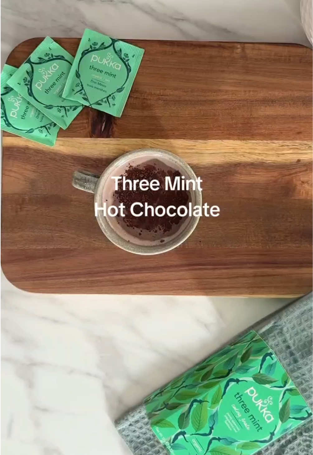 The combo you never knew you needed: Pukka Three Mint Tea Hot Chocolate 🍵🍫 Ingredients: A high-quality hot chocolate powder Milk of your choice Pukka Three Mint teabag Method: Mix together hot chocolate powder with milk. Add Pukka Three Mint tea bag to mixture. Bring pan to hob and steep the tea bag until thoroughly heated through. The mixture should look velvety and smooth. Remove pan from hob with tea bag still in the mixture. Give the mixture one last stir using the steeped tea bag. Remove tea bag from pan. Pour final hot chocolate into your favourite mug and enjoy 🤤 #PukkaTea #HotChocolate #MintHotChoc #HotChoc #Recipe #HotChocolateRecipe #FYP #HerbalTea 