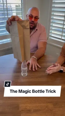 How does the bottle go through the table? #magic #illusion #bottle #trick #magician #fyp 