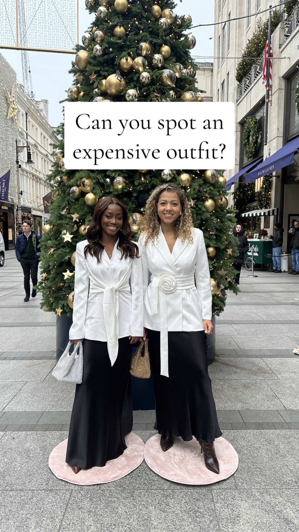 One of these festive drinks looks costs £4695 and the other costs £487, but which is which? 👀   #minimic #designer #highstreet #OOTD #outfitinspo #fashiontiktok #guessinggame #guessinggame #streetinterview  Satin skirt Silk skirt White blazer  Bond street 