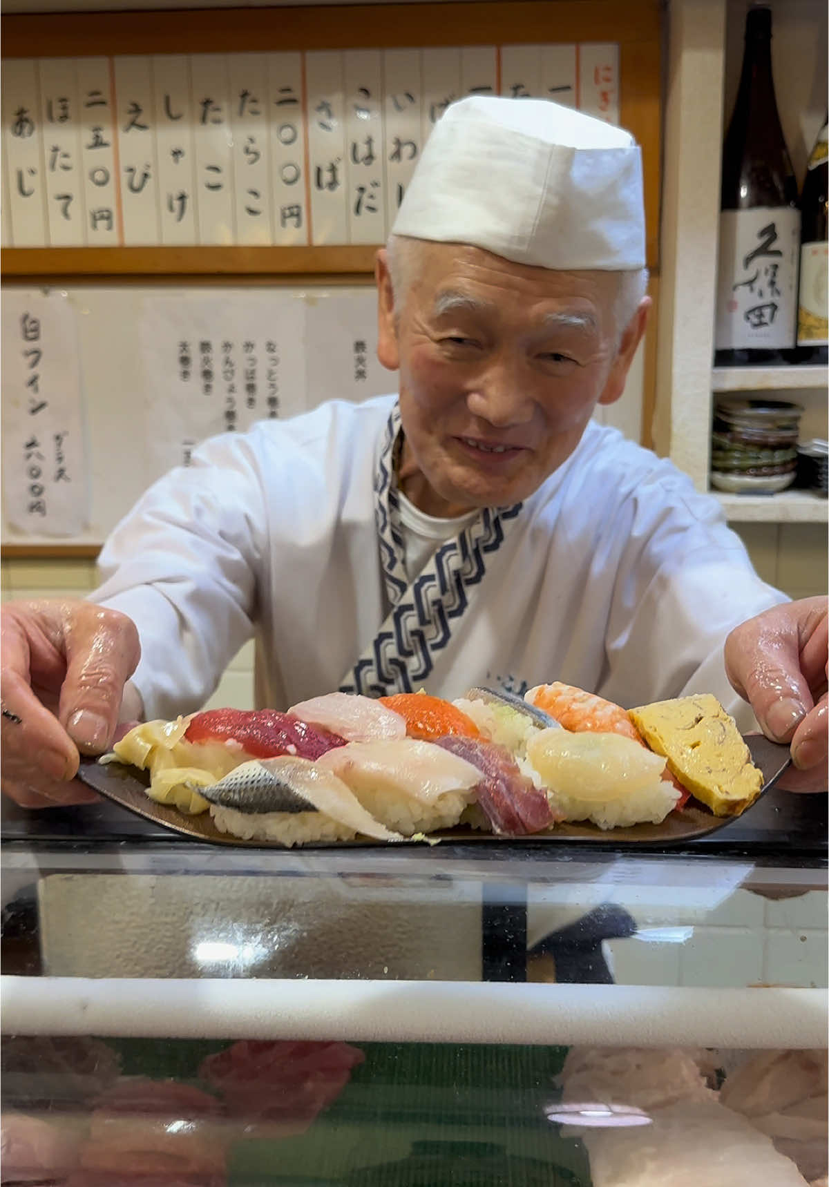 — Ikoma Sushi — 72 years old sushi shop owner in tokyo! The fresh custom made delicious sushi could be enjoyed for ¥500 The smile the old master has elevates the expericence, the fresh taste of the menu is surely different than big city! #japanesefood #japan #tiktokfood #東京グルメ #東京ランチ #ghibli #japanese #tokyo #sushi 