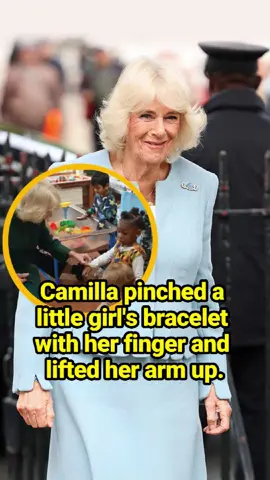 Camilla pinched a little girl's bracelet with her finger and lifted her arm up.  #celebrity #fyb #QueenCamilla #britishroyalfamily