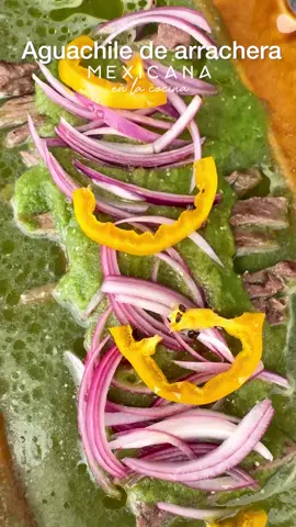 Receta de aguachile.  Estoy segura que ye estas salivando com este aguachile de arrachera. Es tan rico y fácil que es una receta 100% ganadora.  Ingredientes  Arrachera marinada de @Ganadería Revuelta  6 tomates  Cilantro  2 dientes de ajo  1/4 de cebolla  Chile jalapeño al gusto sin semillas  1/2 cebolla morada El jugo de 4-5 limones  Sal Pimienta  Chile peron, manzano o habanero  Aceite de oliva  Elaboración  Primero prepara la arrachera, córtala en tiras y deja reposar.  Ahora licua los tomates, cilantro, ajos, cebolla, chile, sal, pimienta con  1/2 taza de agua.  Agrega esta salsa a la arrachera.  Corta la cebolla morada en plumas, añade el jugo de limón, la sal, mezcla y deja reposar unos 15-20 minutos .  Agrega las cebollas  a la arrachera, el chile manzano, un chorrito de aceite de oliva y listo .  Mis hijos devoraron y me pidieron que la haga mas seguido.  Con cariño, Gio . . . . #Receta #recetasfaciles #aguachile #aguachileverde #carne #arrachera 