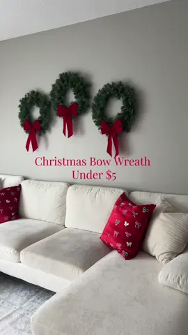 DIY Christmas Bow Wreath for Under $5 AND 5 minutes!!  These are so easy to DIY & and make the cutest Christmas decor. Each wreath + bow is just under $4.50 each. No hot glue required!  All supplies are from @Walmart  #walmartchristmasfinds #christmasdecor #wreathmaking #bow #budgetfriendly #decoronabudget #under5dollars #diyproject #diydecor #5minutecrafts 