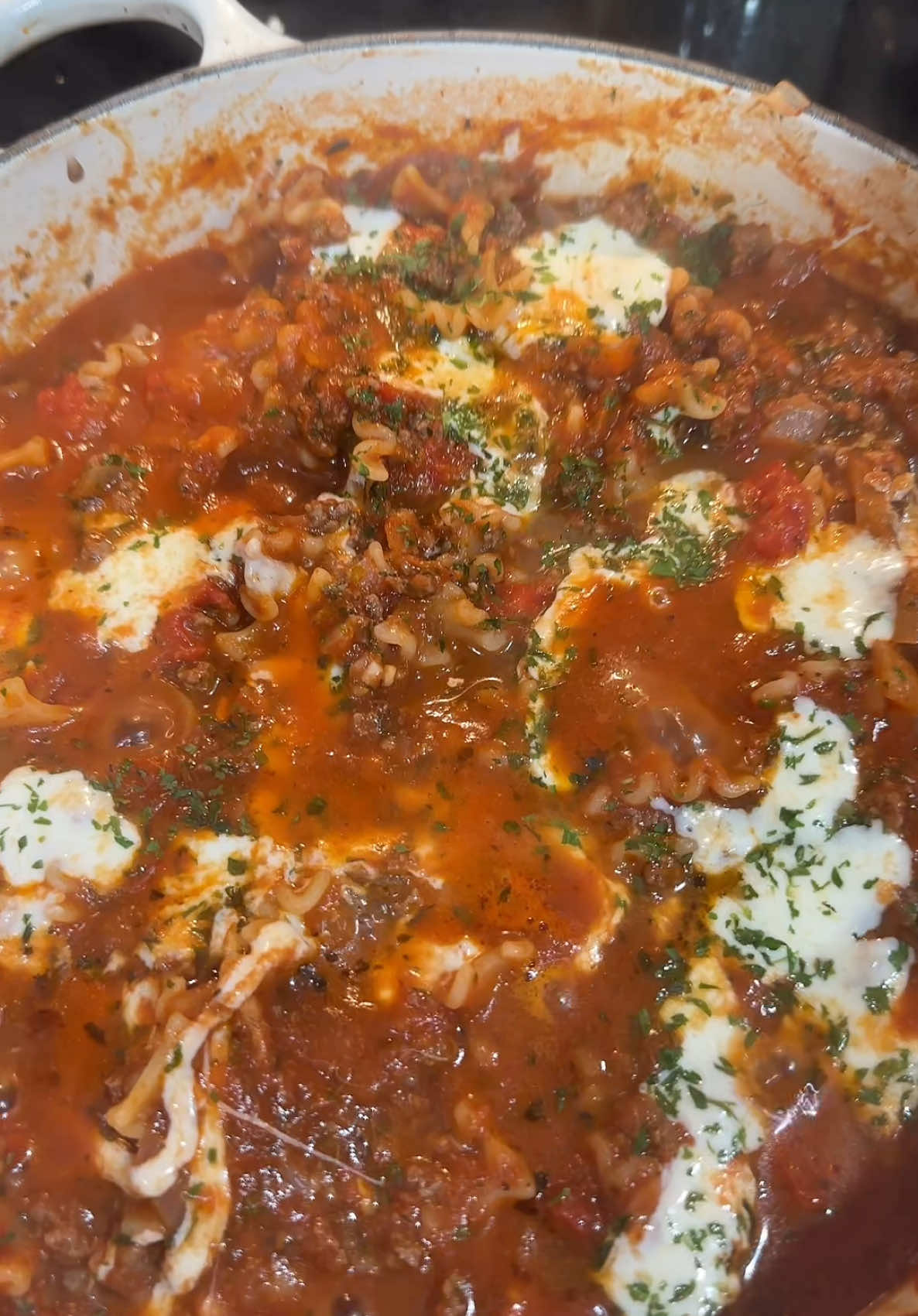 I pound of ground beef (or whatever meat you like)  Drizzle of cooking (I use avocado oil) 1/2 chopped white onion  Tablespoon of chopped garlic (I used jarlic) 2 tbs of dried Oregano  Salt and Pepper to taste  2 tbs of Italian Seasoning  24 oz jar of pasta sauce 12 cherry tomatoes cut in half  15 oz ricotta cheese    8 oz Mafalda Corta Pasta (i use Trader Joe’s) 1 cup grated Parmesan  12 Fresh mozzarella pearls (more if you want it super cheesy) Fresh or dried parsley  In pot begin boiling water for pasta and cook it al dente.  Add oil to a seperate pot, brown meat and add seasonings. Add onion and cook until translucent. Add garlic and cook for 1 minute. Add pasta sauce, tomatoes, ricotta cheese, and Parmesan cheese. Stir and let simmer for three to four minutes. Drain pasta and and add to pot. Stir and then add mozzarella to the top and sprinkle with parsley. Cover and let low simmer for 15 minutes.  ##pasta##pastatiktok##lasagna##lasagnarecipe##fyp