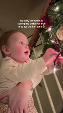 she loves it🥹 you can see the wonder in her eyes!!  #babysfirstchristmas #christmas #christmastree #babysreaction #newmom #firsttimemom #christmasbaby 