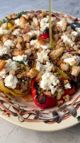 For episode 9 of ItaLEAN I've whipped up a 20 minute ROASTED STUFFED PEPPER DINNER that is light, satisfying and absolutely gorgeous! Serving dish from  Ingredients: 7 bell pepper 1 tbsp olive oil 1 lb ground turkey 96% lean ¾ tsp salt 1 tsp paprika ½ tsp garlic powder 1 onion, diced 3 tbsp chopped fresh parsley 1 bundle scallions chopped 7 ounces burrata 1 ½ cups croutons 2 tbsp extra virgin olive oil Instructions: -Preheat oven to broil -Cut the pepper in half, deseed and place them onto a baking sheet. Lightly coat the peppers with the olive oil and broil on the middle rack for 4 minutes. Transfer to the top rack and broil for 3 minutes or until charred.  -Add the turkey to a non-stick skillet and season with salt, paprika and garlic powder. Cook over medium-high heat breaking the turkey down into small pieces as it cooks. When the turkey is no longer pink, add the onions and cook for 3 minutes more. Remove from heat and mix in the parsley and the scallions.  -Fill the peppers with the turkey stuffing, top with burrata, croutons and a drizzle of good extra virgin olive oil.  #EasyRecipe #easydinner #quickrecipes #healthyrecipes #italean 