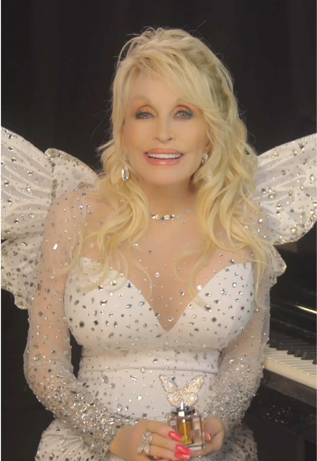 Let my brand new @dolly beauty Crystal Edition Parfum carry you away. You never know where you might end up 🦋 Each bottle is made of solid crystal, crowned with a handmade rhinestone-studded butterfly cap, and individually numbered – a true collectible. Only 1,946 bottles will ever be produced. Available now, shop this exclusive new fragrance by visiting the #DollyBeauty website!