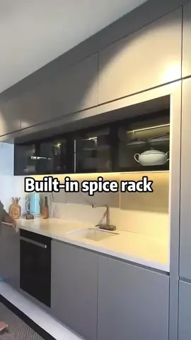 Spices at your fingertips, yet hidden in style! This sleek built-in spice rack keeps your kitchen organized and elegant. Just slide, and voilà—culinary magic awaits!   #HiddenStorage #SpiceRack #KitchenInnovation #ModernKitchen #HomeDesign #KitchenOrganization #SmartStorage #MinimalistLiving 