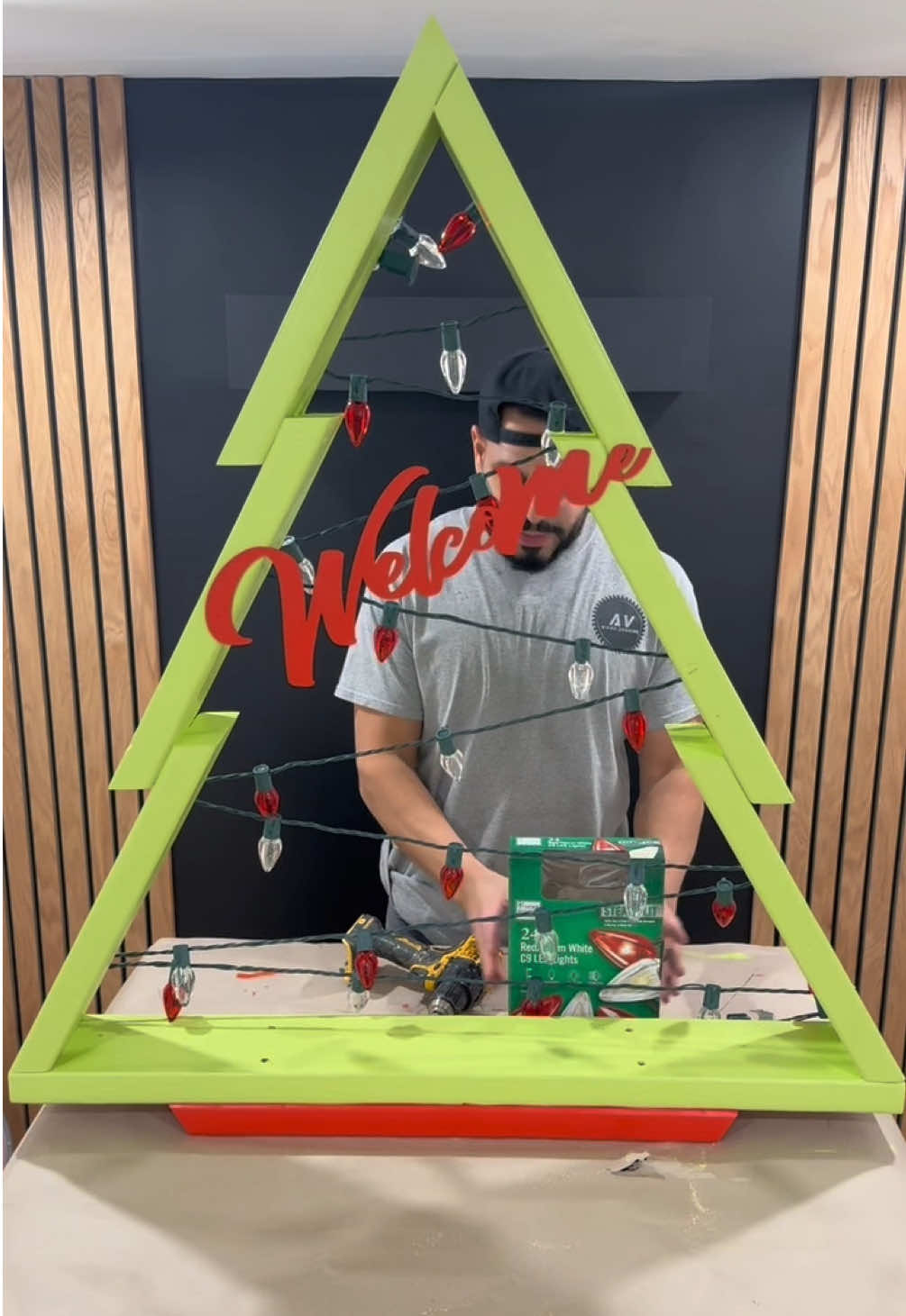 Crafted this DIY Christmas tree using 2 -2 x 6  and 2-1/2 wood screws! Cut each piece at a 30 degree angle for a sleek , modern twist on a classic holiday favorite. Would you give this DIY Christmas tree a try ? #DIY #process #handmade #christmas #tree 