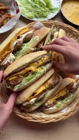 SEMOLINA BREAD FILLED WITH GROUND BEEF   #food #Recipe #bread #beef #tasty #fy #fyp #foryoupage DOUGH   425 g flour (all-purpose)   75 g fine semolina   7 g instant yeast (1 tablespoon or 1 sachet)   15 g honey   8 g salt (1⅓ teaspoon)   30 ml olive oil   20 g unsalted butter   260 ml lukewarm water   MEAT MIXTURE  700 g ground meat   5 g salt (⅚ teaspoon)   6 g ras el hanout (2 teaspoons)   3 g turmeric powder(1 teaspoon)   2 g cayenne powder (⅔ teaspoon)   3 g garlic powder (1 teaspoon)   2 g onion powder (⅔ teaspoon)   0.5 g dried parsley   35 g red onion (half a red onion)   10 g sambal oelek   SERVE WITH   cheese sauce   fries   Instructions Combine the flour, fine semolina, yeast, honey, salt, olive oil, butter, and lukewarm water in a large bowl. Mix well and knead the dough for 10–12 minutes until smooth and elastic. Cover the dough and let it rise in a warm spot for 1 hour or until it doubles in size.   Deflate the dough and divide it into 9 equal portions (about 88 g each). Shape each portion into a ball.   Roll out each ball into a round sheet using a rolling pin.   Fold down the top edge of the dough slightly and press gently. Then roll it up tightly into a firm log.   Pinch the seam securely to seal and ensure there are no gaps.   Lightly roll the log in fine semolina.   Place the dough logs on a baking tray lined with parchment paper. Make small slits in each roll using a sharp knife. Let the dough rise for 30 minutes or until doubled in size.   Preheat the oven to 200°C (392°F) and bake the semolina rolls for 12–18 minutes, or until golden brown. Let them cool slightly before serving.   --- For the meat mixture In a large bowl, combine the ground meat, salt, ras el hanout, turmeric powder, cayenne powder, garlic powder, onion powder, dried parsley, finely chopped red onion, and sambal oelek. Mix well.   Take a portion of the meat mixture and shape it into a ball. Flatten it slightly.   Heat a drizzle of olive oil in a skillet over medium heat. Cook the patties on both sides until golden brown and cooked through.