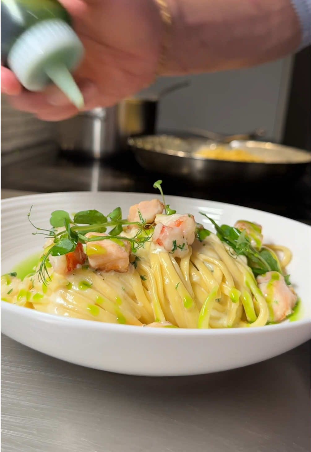 Let’s fall in love and make pasta. #pasta #salmon #linguine  Linguine pasta with sautéed salmon and prawn, chilli, garlic, parsley oil, and Parmesan cheese. A wonderful creamy pasta dish that has a lovely seafood taste, creamy and rich, and a pleasant kick of chilli. Pasta making is optional and works just as fine with good quality store-bought pasta. Taste 9/10 Visuals ??? Linguine Pasta: Makes 4-5 portions  Ingredients 400 g plain flour 3 eggs 4 egg yolks Pinch of sea salt