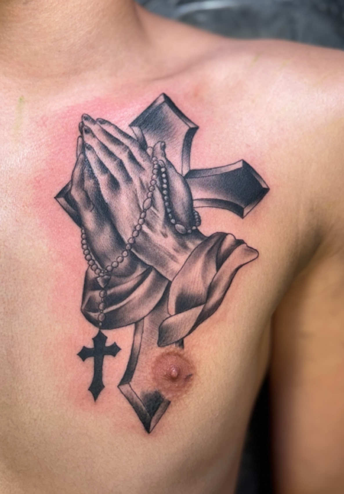 did this classic prayer hands tattoo on his chest the other day. not my usual genre but super fun to do! this guy sat like a champ- this was his first tattoo! #hawaiitiktok #oahu #priestessink 