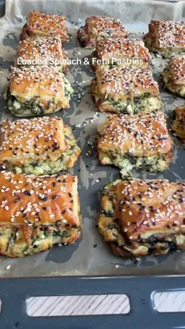12 Days of Christmas Appetizers Pt 11 🎅 Easy spinach and feta pastries  1 x sheet puff pastry  Filling: 1 x onion chopped  150g frozen spinach  1/2 tsp oregano or mint  200g Feta cheese  100g Mozzarella  1 x egg separated (white mixed into filling and yolk mixed with 1 x tsp milk for brushing Sesame seeds Honey  Preheat oven to 180C  Sauté your onion for a few minutes then add frozen spinach plus 1/4 cup of  water. Move the spinach around while the water evaporates and sauté till soft soft and warm. Let it cool down (on a plate is quickest) mix in crumbled feta, grated mozzarella and egg white and set aside. Slice your pastry down the middle length ways and spread the mix over one side (it will thick) cover with the other slice of pastry.  Brush with egg yolk and slice down the middle and across to create 14 squares. Place on a baking sheet with parchment paper, give them another brush with egg wash and sprinkle with sesame seeds. Bake on a low shelf for 33 - 37 minutes. Even if it looks golden don’t take it out, hang tight for a better bake as there is a lot of filling.  Enjoy D 🫶 #fyp #christmas #appetizer #feta #pastry 