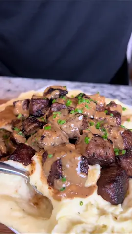 Steak bites and Mashed potatoes 🥩🥔  These two were made for each other, the peppercorn cream sauce is what really sets it off! Enjoy!  Full Ingredient List:  1-1.5 lb steak bites  1-2 tsp garlic powder  1-2 tsp black pepper  1.5-3 tsp salt (optional)  1-2 garlic cloves  2 tbsp butter  For mashed potatoes:  6-8 medium sized yukon gold potatoes peeled  1/4-1/2 cup heavy cream  1/2 stick butter  1/4 cup sour cream  1 tbsp garlic paste  Salt to taste Pepper to taste  For peppercorn sauce:  1/4 cup finely diced onions or shallots  1 medium garlic clove  15-20 crushed peppercorns  2-3 dashes Worcestershire sauce  1-2 tsp flour  Salt to taste (optional)  Chives to garnish #steakbites #mashedpotatoes #eatwitzo 
