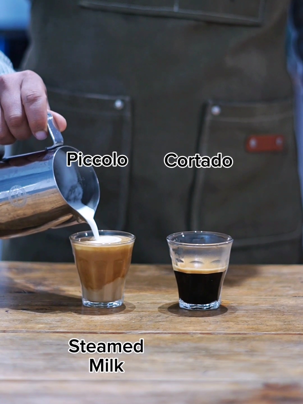 Piccolo Vs Cortado. Piccolo(Usually arround 4oz): Ristretto with steamed Milk Cortado(Usually Arround 4-5oz): Double espresso with steamed Milk 1:1 coffee to milk ratio. #wavespecialitycoffeeacademy #coffeeschool #baristatraining #coffeeschool #coffee #baristaschool #fyp #tiktok #nepal #kathmandu #video #viralvideo #viraltiktok #trending #pourover  #trendingnepal #latteart #trendingvideo #barista 