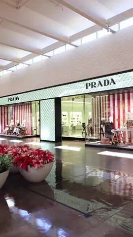 Prada is now open! 🖤 The iconic Italian luxury brand has arrived at NorthPark Center in a stunning 10,000-square-foot space on Level One.   As the only Prada store in North Texas, the NorthPark boutique showcases the men's and women's collections including ready-to-wear, leather goods, footwear, and accessories, as well as lifestyle, gifting, and fine jewelry.    The expansive interior features the brand's signature design elements—soft pastel green tones contrasting with the black-and-white checkered marble floor.