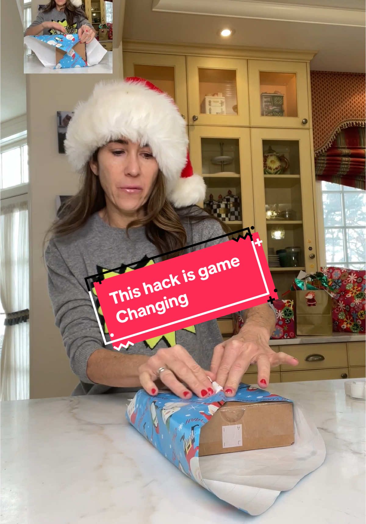Hack for wrapping gifts when your out if paper! #hack #holiday #christmas #LearnOnTikTok #giftwrapping 