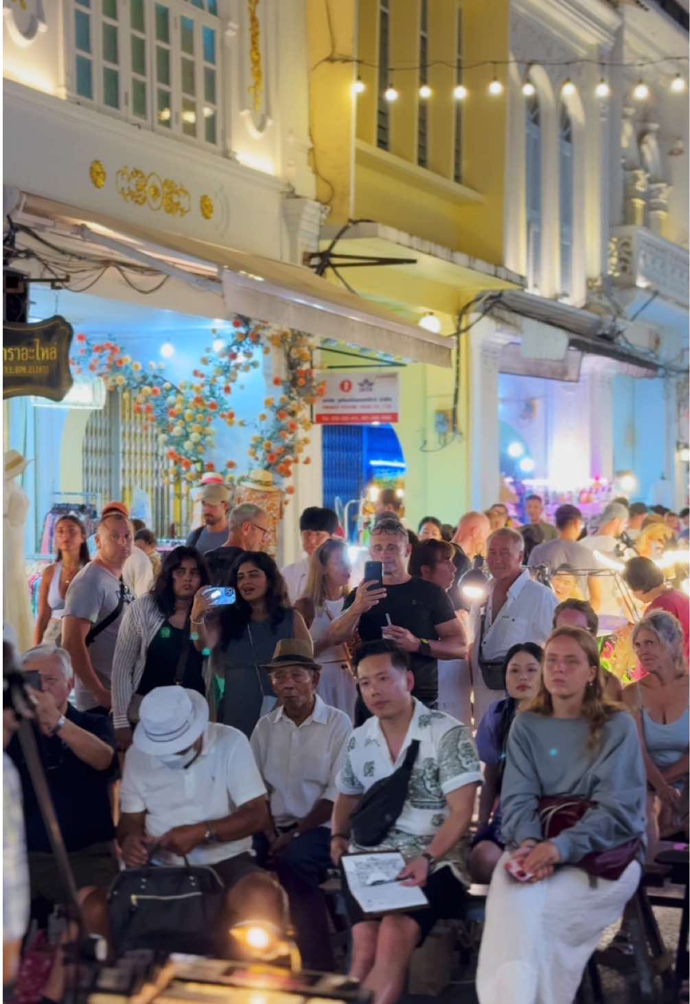 The Sunday Market in Old Town Phuket is one of our favorites, offering a vibe that's truly one of a kind. The perfect blend of mouthwatering street food, vibrant lights, and heartfelt moments like a busker singing a beautiful song creates an unforgettable atmosphere. Today is Sunday, if you're in Phuket, this is a must-see experience! #phuketoldtown #phuket #oldtownphuket #thailand #fyp #foryou 