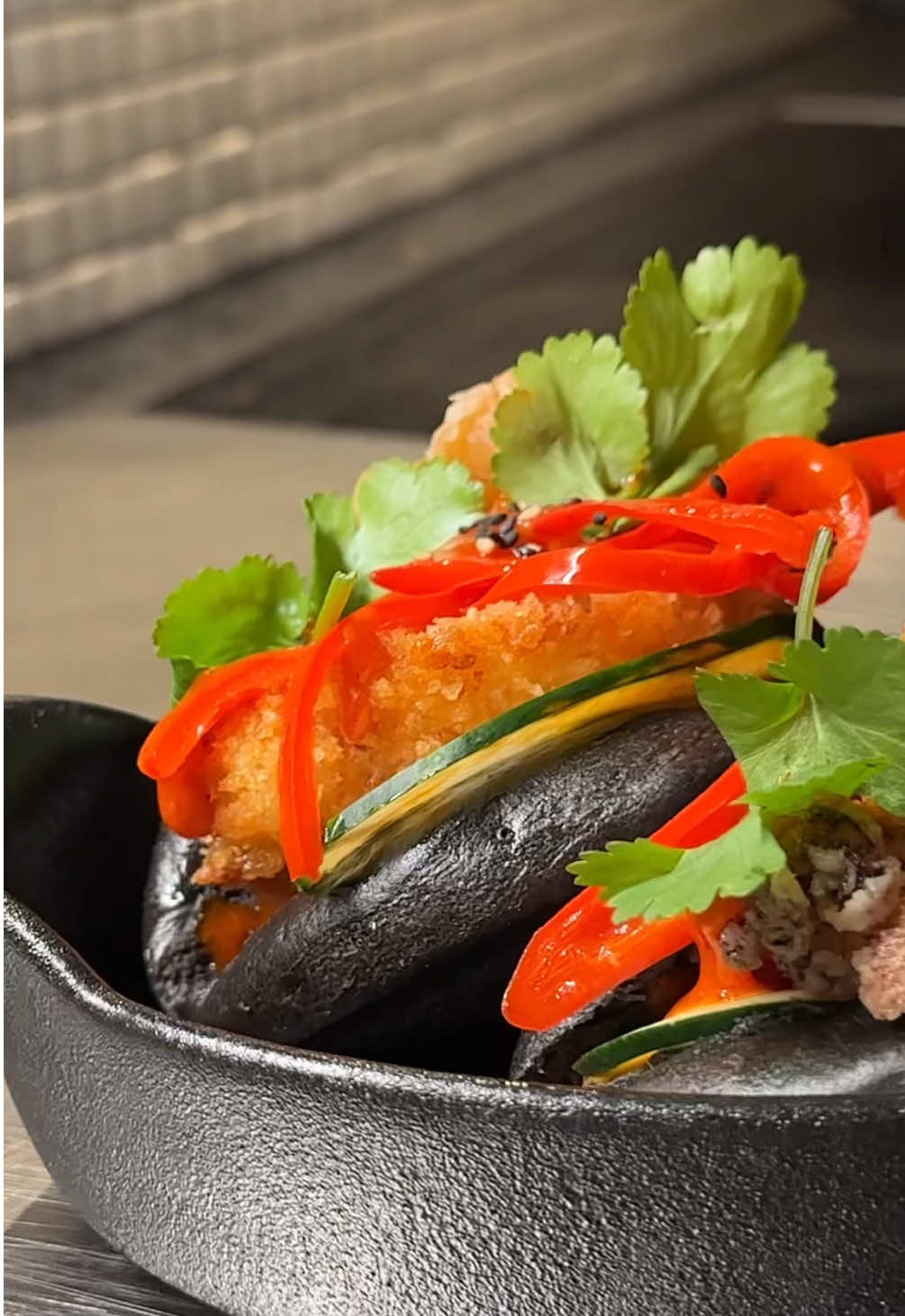 Episode 65 | If she likes her bun filled with pleasure. #baobuns #prawns #squid #mayo  Visuals ??? Taste 9.5/10 Black bao buns (with cuttlefish ink) served with fried prawns and squid, semi-fried chillies, Gochujang mayo, fresh coriander, cucumber and toasted sesame seeds.  Gochujang Mayo: Ingredients 25% Gochujang 75% Mayo Full recipe breakdown on my website (soon)!