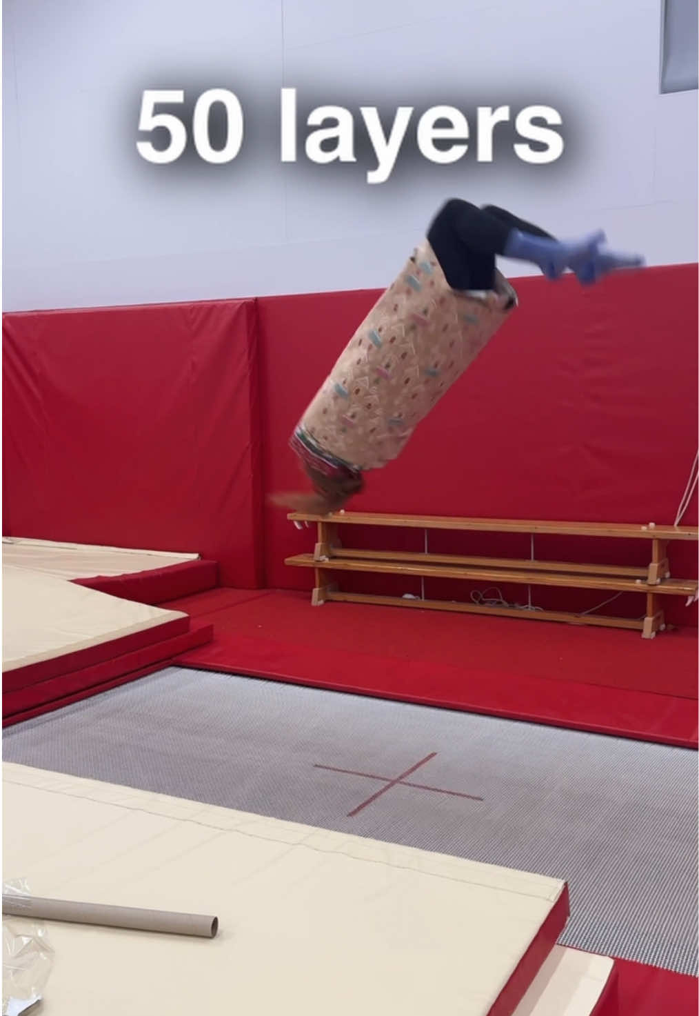 How many layers of wrapping paper can stop a backflip?🤸‍♀️👀 #gymnastics #luciecolebeck #gymshark #gymnasticschallenge 